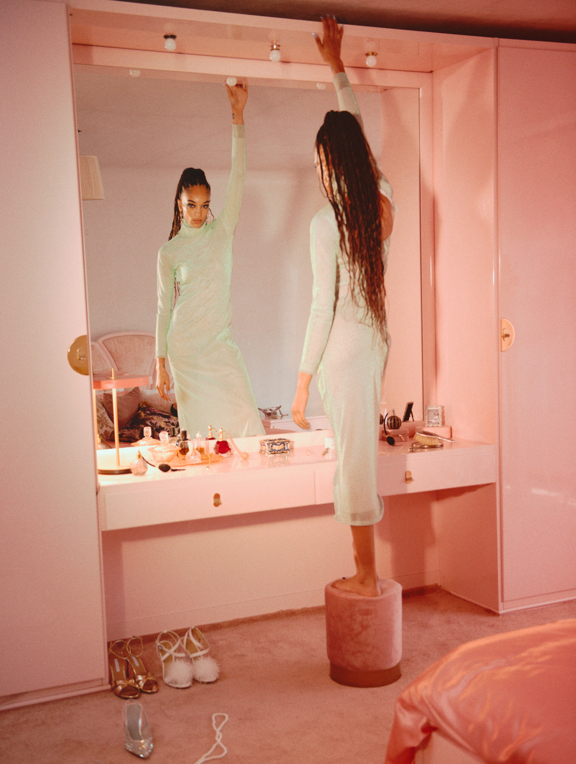 Pink bedroom with fashion model for Elle UK